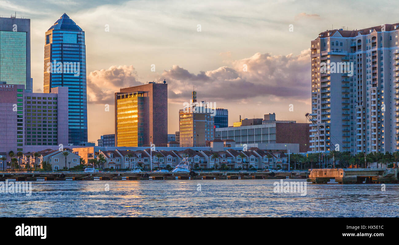 Sunset on downtown buildings and bridges on St Johns River in downtown