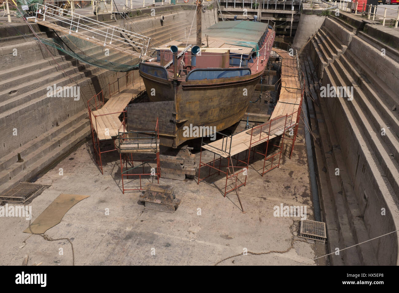 Work in progress on repairing and restoring unpowered barge Sabrina 5