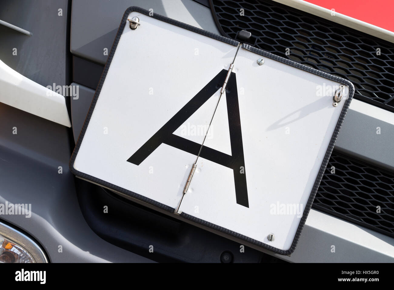 vertical foldaway A-plate (German warning plate for garbage transports) Stock Photo