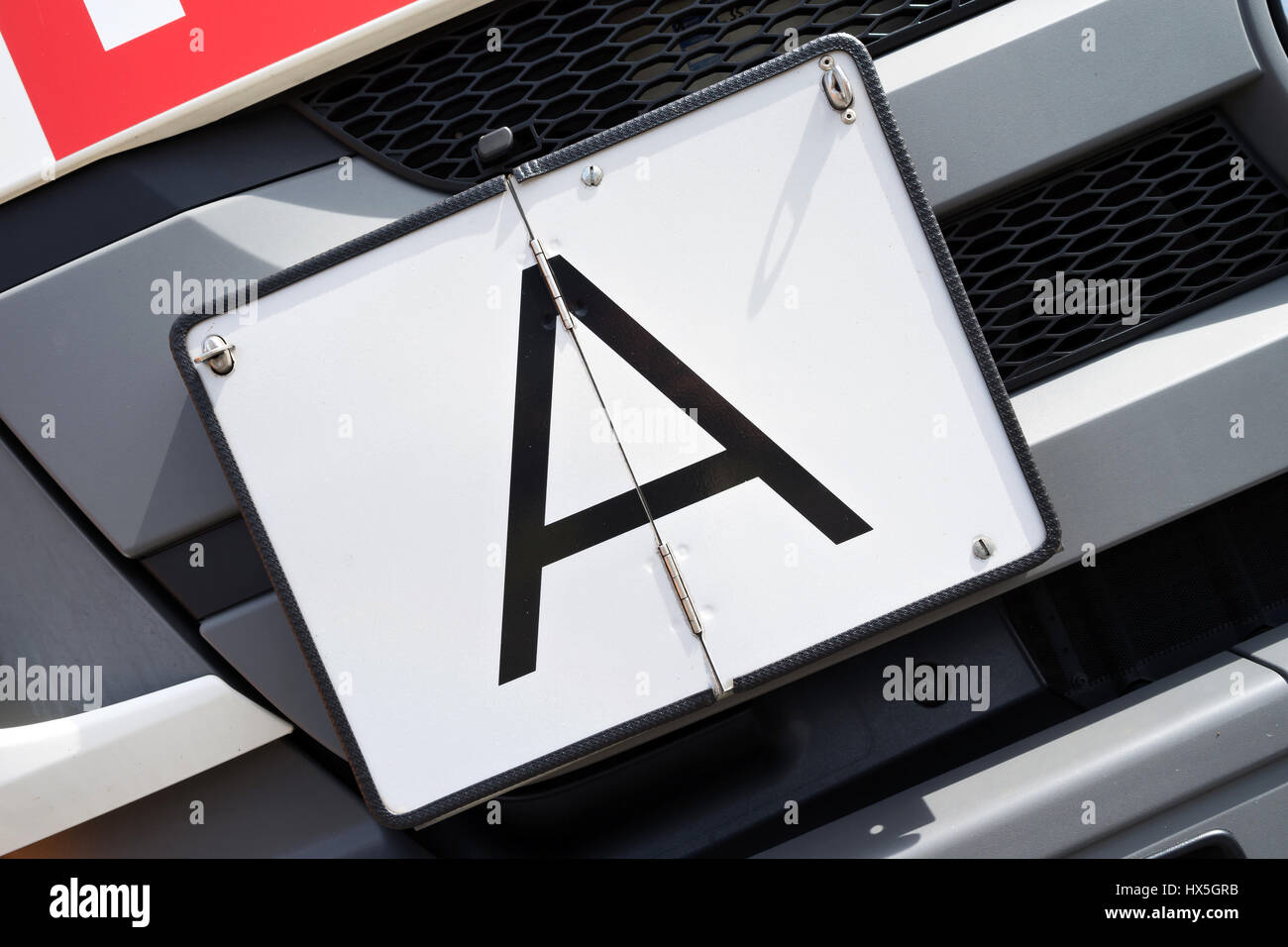 vertical foldaway A-plate (German warning plate for garbage transports) Stock Photo