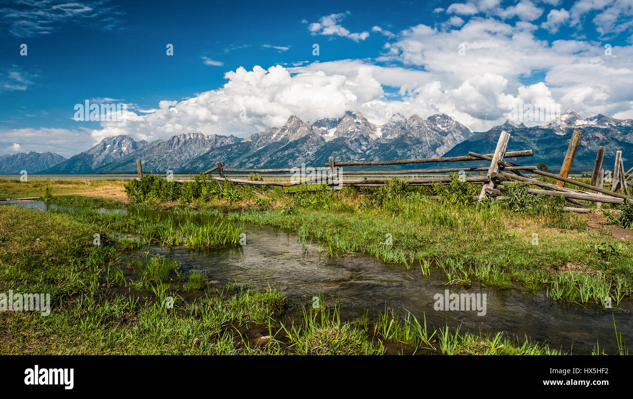 A wooden fence a fresh spring in the mountains Stock Photo - Alamy