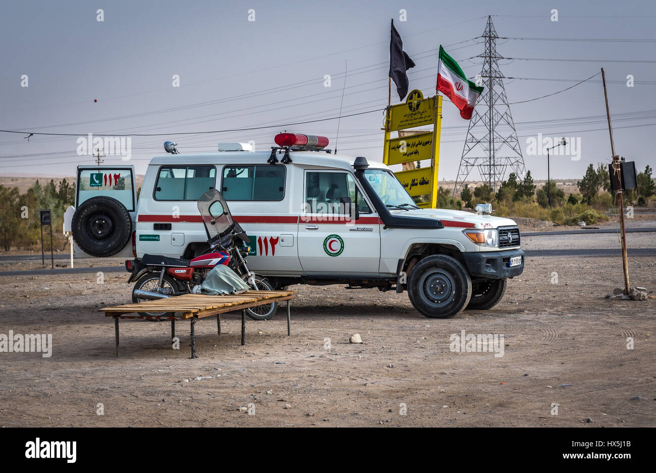 Red Crescent Society of the Islamic Republic of Iran car on the road to  Maranjab Desert located in Aran va bidgol County in Iran Stock Photo - Alamy