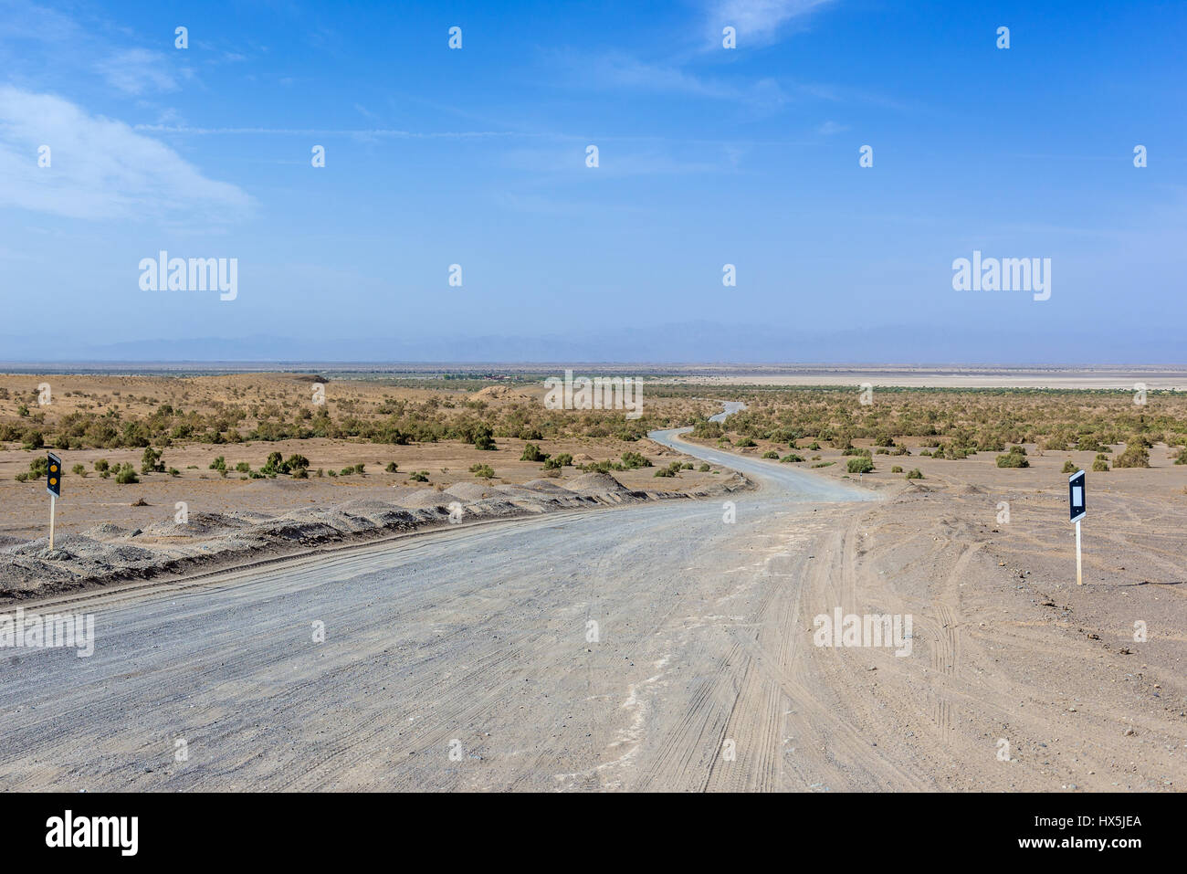 Dirt road on Maranjab Desert located in Aran va bidgol County in Iran Stock Photo