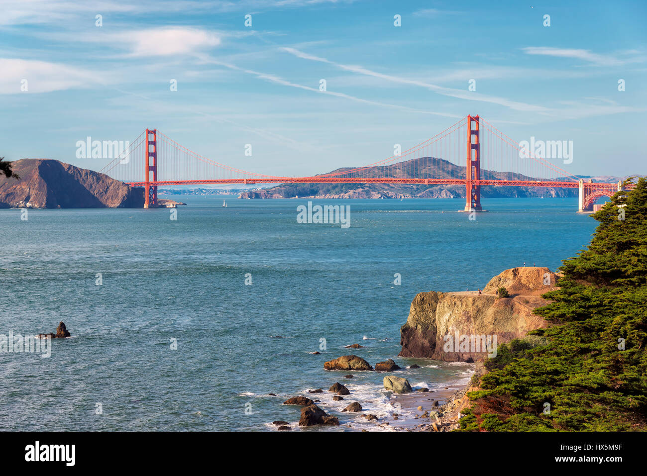 San Francisco beach and Golden Gate Bridge at sunrise, California. Stock Photo