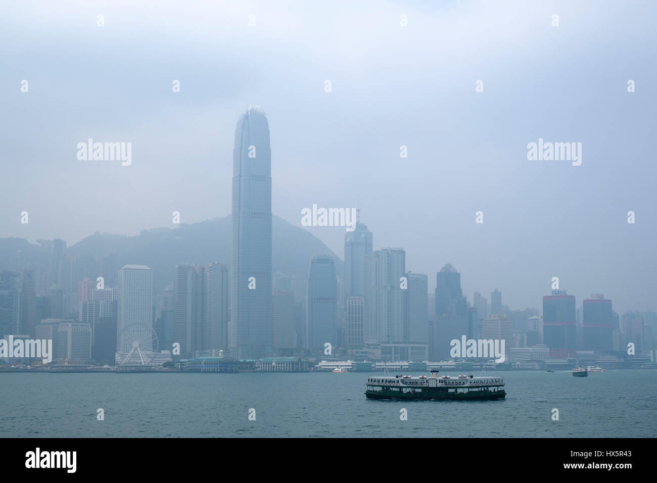 A Star Ferry boat with the IFC (International Finace Centre) and other Hong Kong Island skyscrapers in the background, Hong Kong, China. Stock Photo