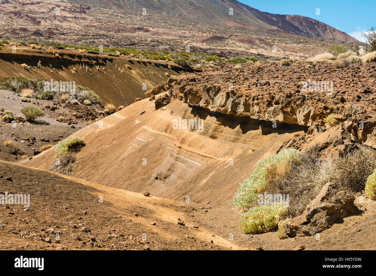 Profile of ash layers covered by lava rock in a barranco in the caldera of Tenerife, Spain. Stock Photo