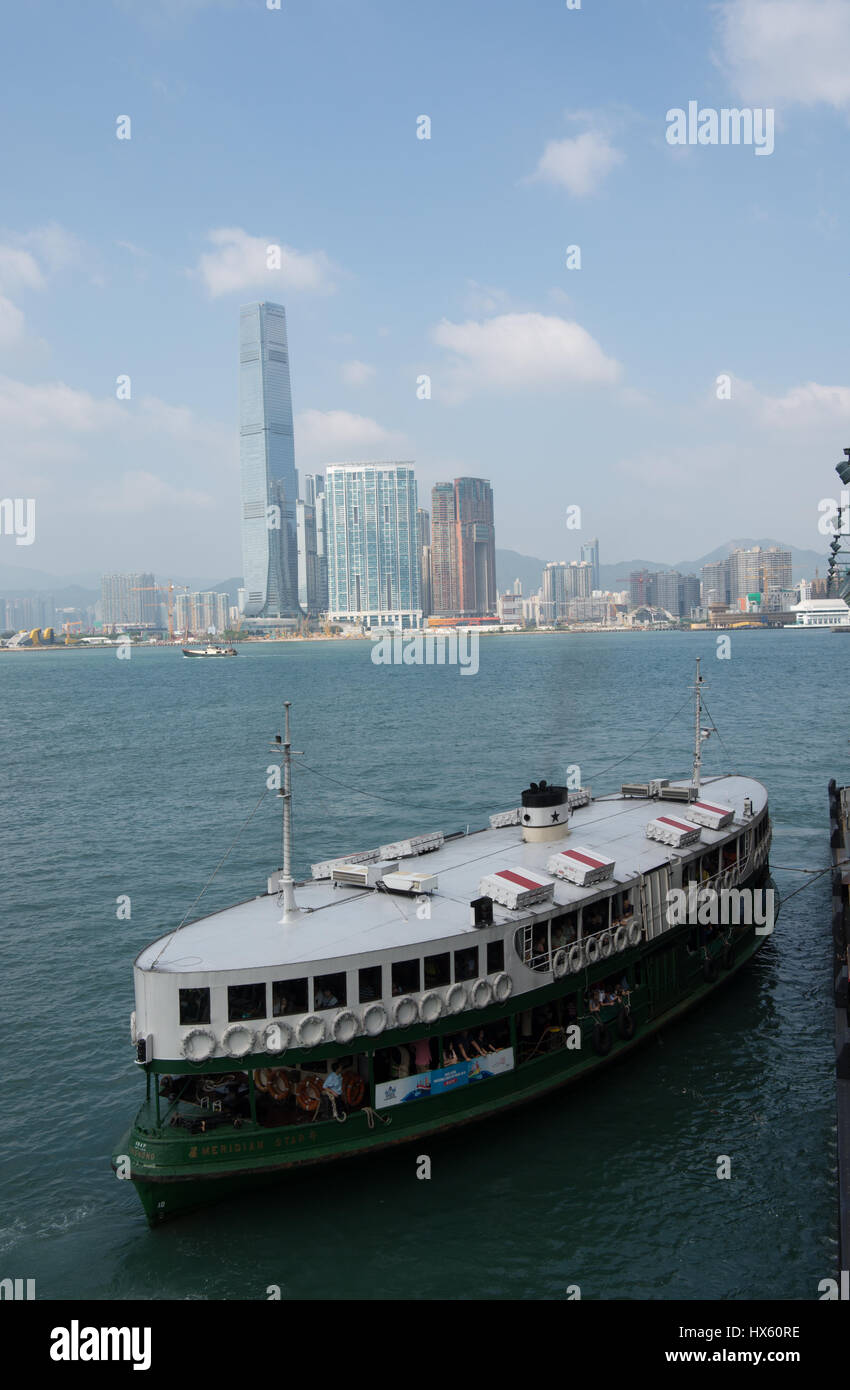 St Ferry Meridian Star about to dock at the Wan Chai ferry terminal. The skyscrapers of Kowloon East are in the background Stock Photo