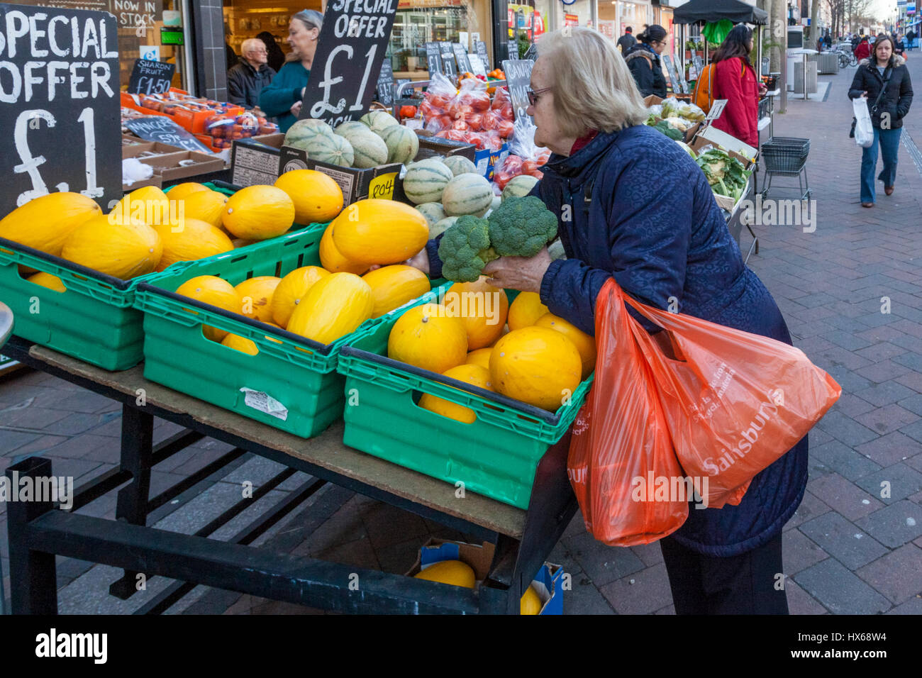 Person shopping for fruit and vegetables at a local fruit and veg shop,  Beeston, Nottinghamshire, England, UK Stock Photo