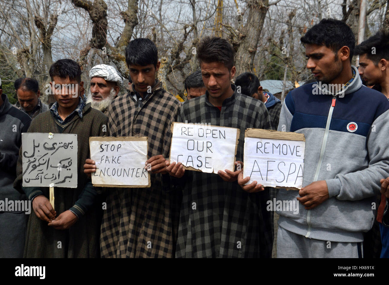 Carrying placards and banners reading ‘Reopen the Pathribal fake ...