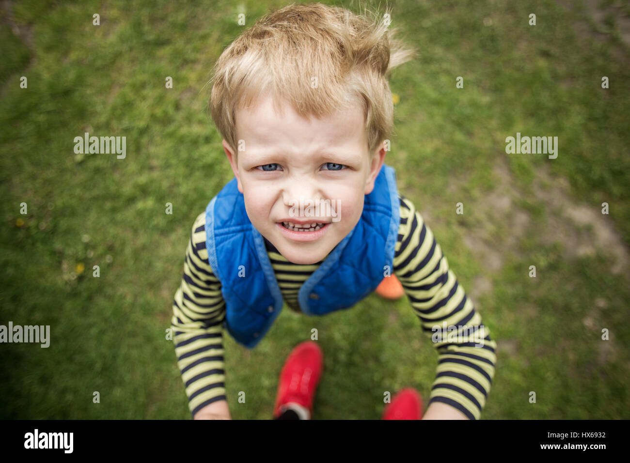 Naughty boy looking up. Outdoor portrait. Close up Stock Photo