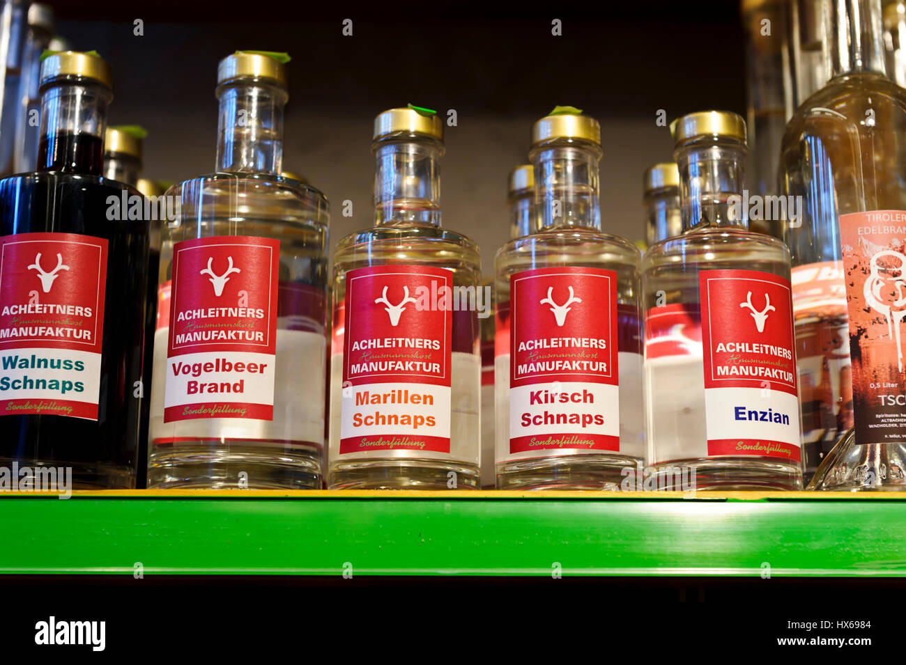 Bottles with schnapps for sale in the indoor market, Innsbruck, Austria Stock Photo