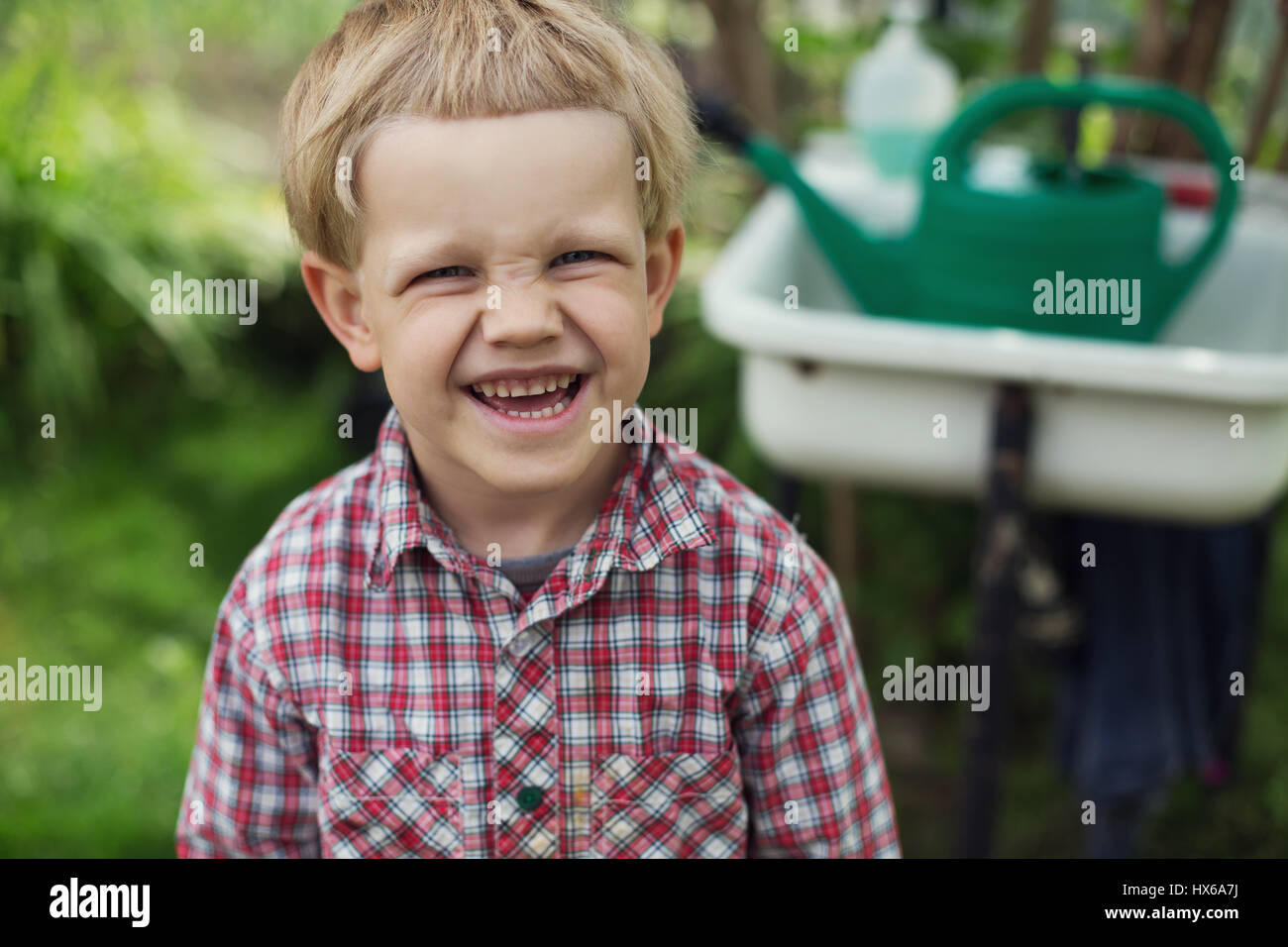 Cute little boy in garden. Outdoors portrait Stock Photo