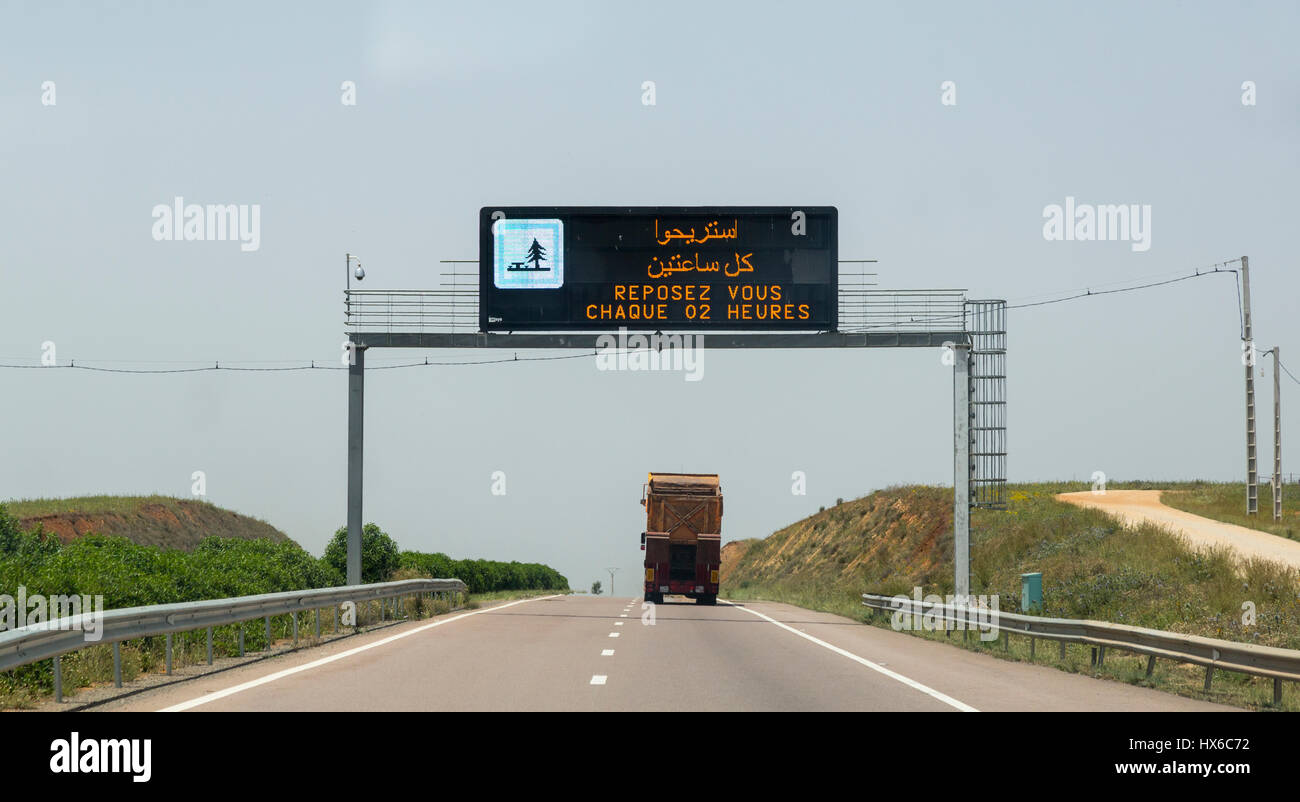 Morocco.  Highway Safety Sign ('Rest Every Two Hours') on A-2, between Meknes and Rabat. Stock Photo
