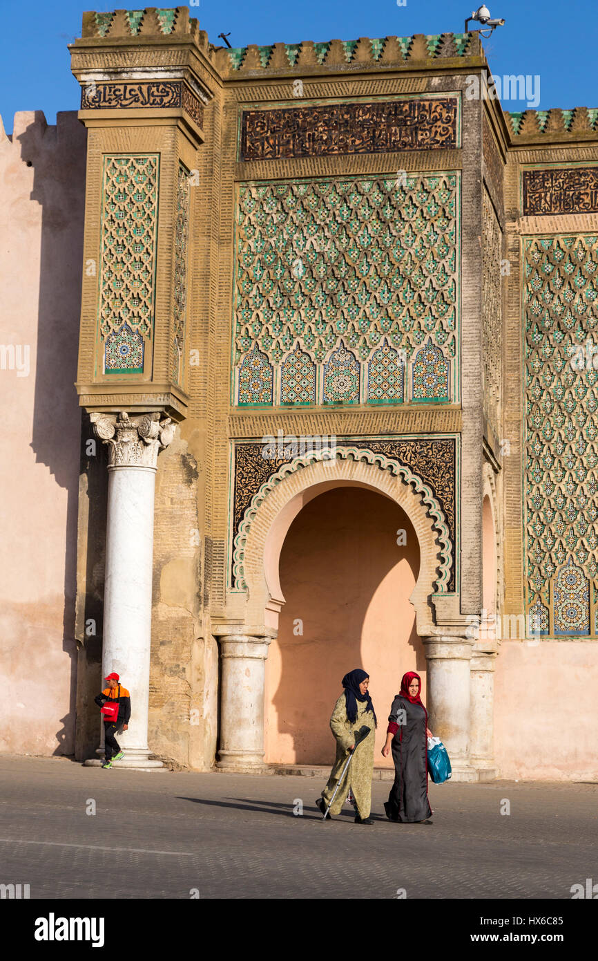 Meknes, Morocco.  Two Women Walking in front of the Bab Mansour, built 1672-1732. Stock Photo