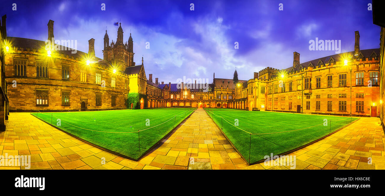 Australian tertiary education institution - university in Sydney at sunset. Panoramic courtyard of main historic building on university campus - quadr Stock Photo