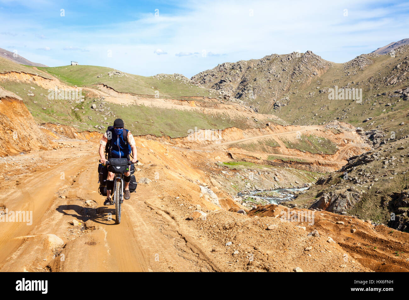 Cycle tourist on a dirt road in Pontic Mountains of Northern Turkey Stock Photo