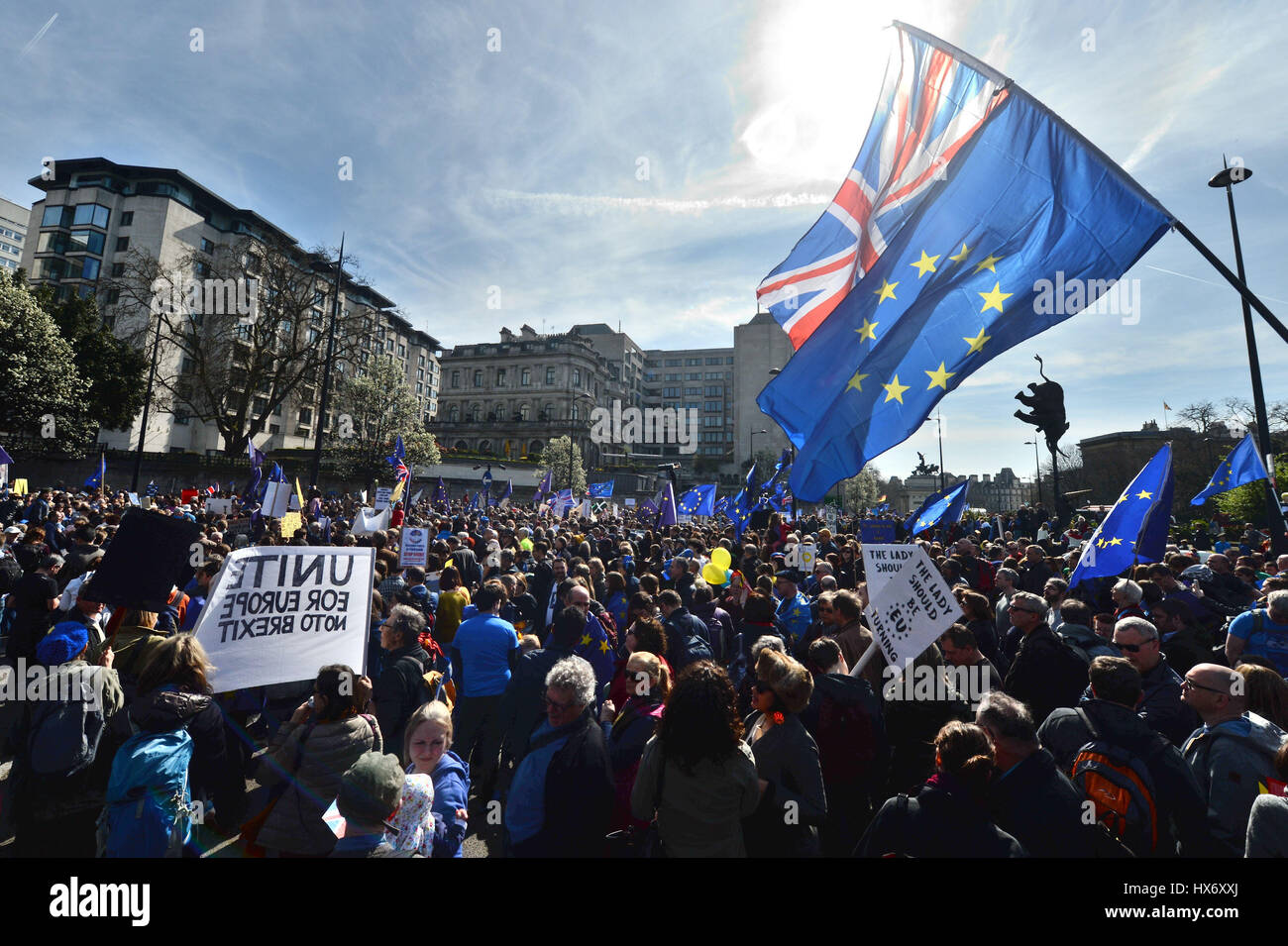 A Union flag and a European Union flag are flown together by a pro-EU protester taking part in a March for Europe rally against Brexit in central London. Stock Photo