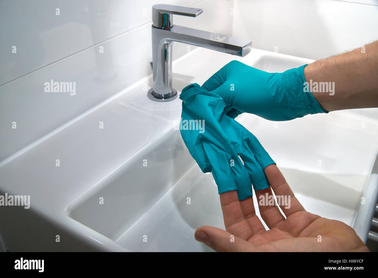 taking of medical gloves, close up Stock Photo