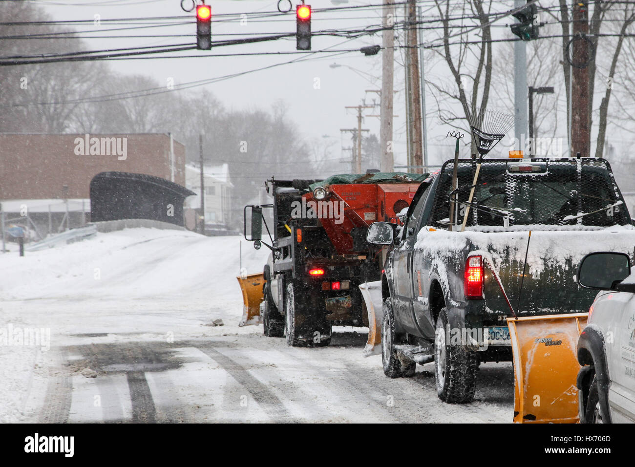 Plow trucks on West Cedar street after winter storm Stock Photo - Alamy