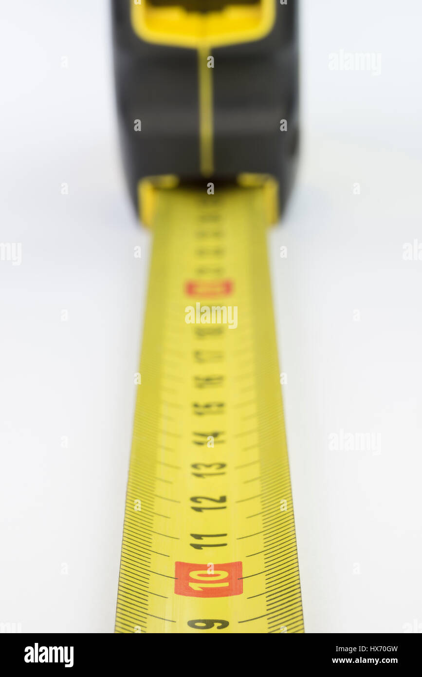 Yellow metal industrial tape measure with standardized metric system