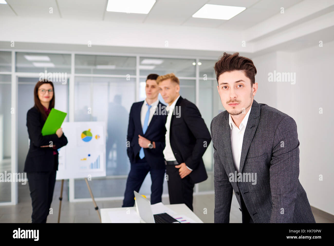 Businessman  looking stand on  background of business team the o Stock Photo