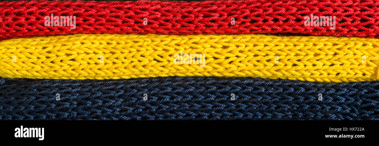 Knitted fragments of the flag colors red, blue, yellow Stock Photo Alamy