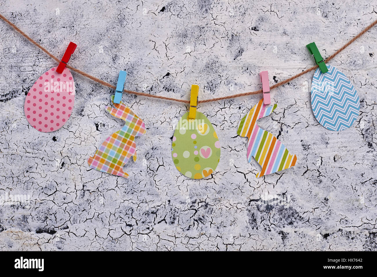 Easter paper cutouts on rope Stock Photo - Alamy