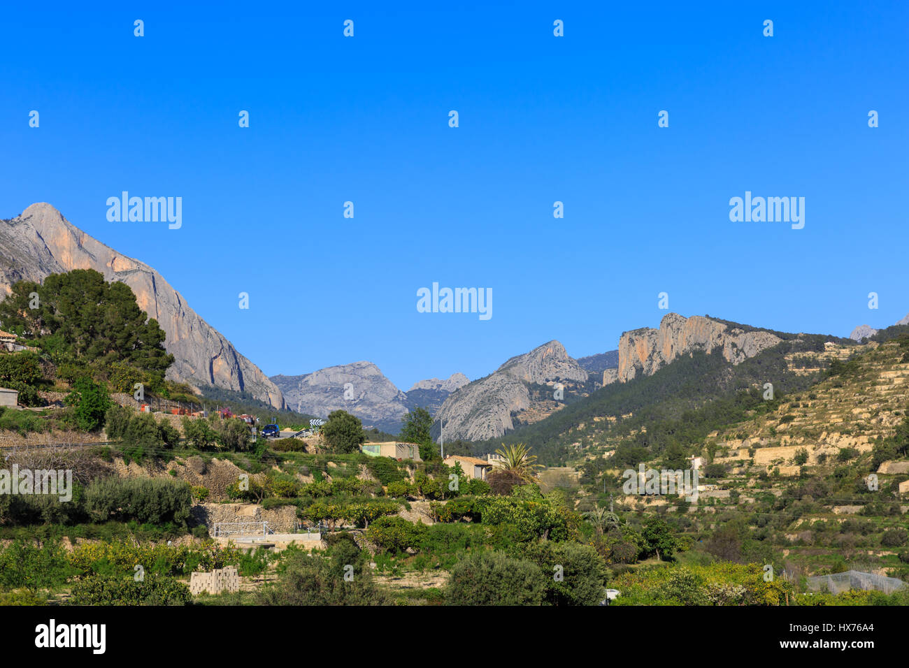 Landscape and mountain range near Sella with clear blue sky, Alicante Mountains, Costa Blanca, Spain Stock Photo