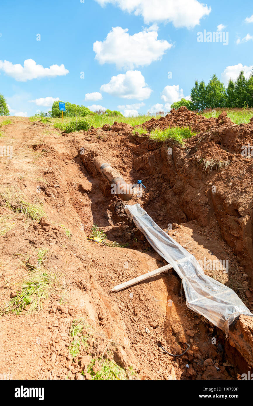 Laying underground gas pipeline in summer day Stock Photo - Alamy