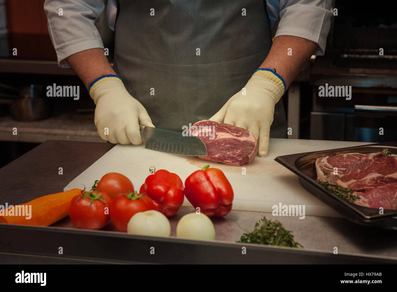Chef butcher cutting lamb hi-res stock photography and images - Alamy