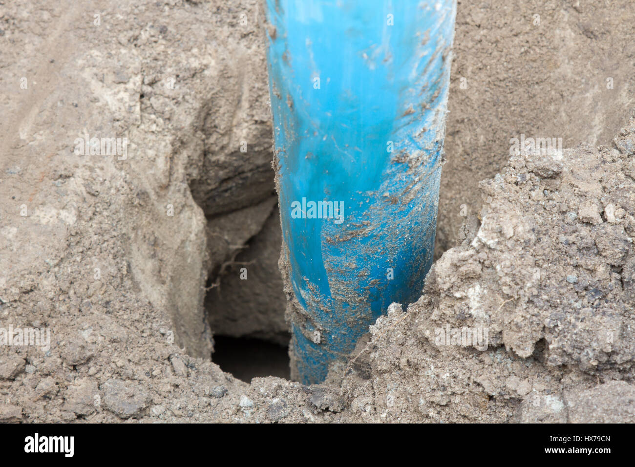 Large plastic pipe sticking out of the ground Stock Photo Alamy