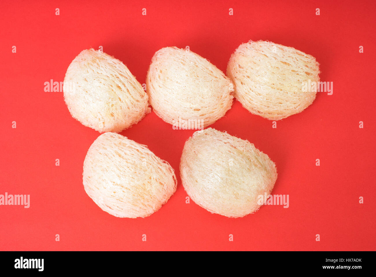 Fresh edible bird's nest on red paper Stock Photo Alamy