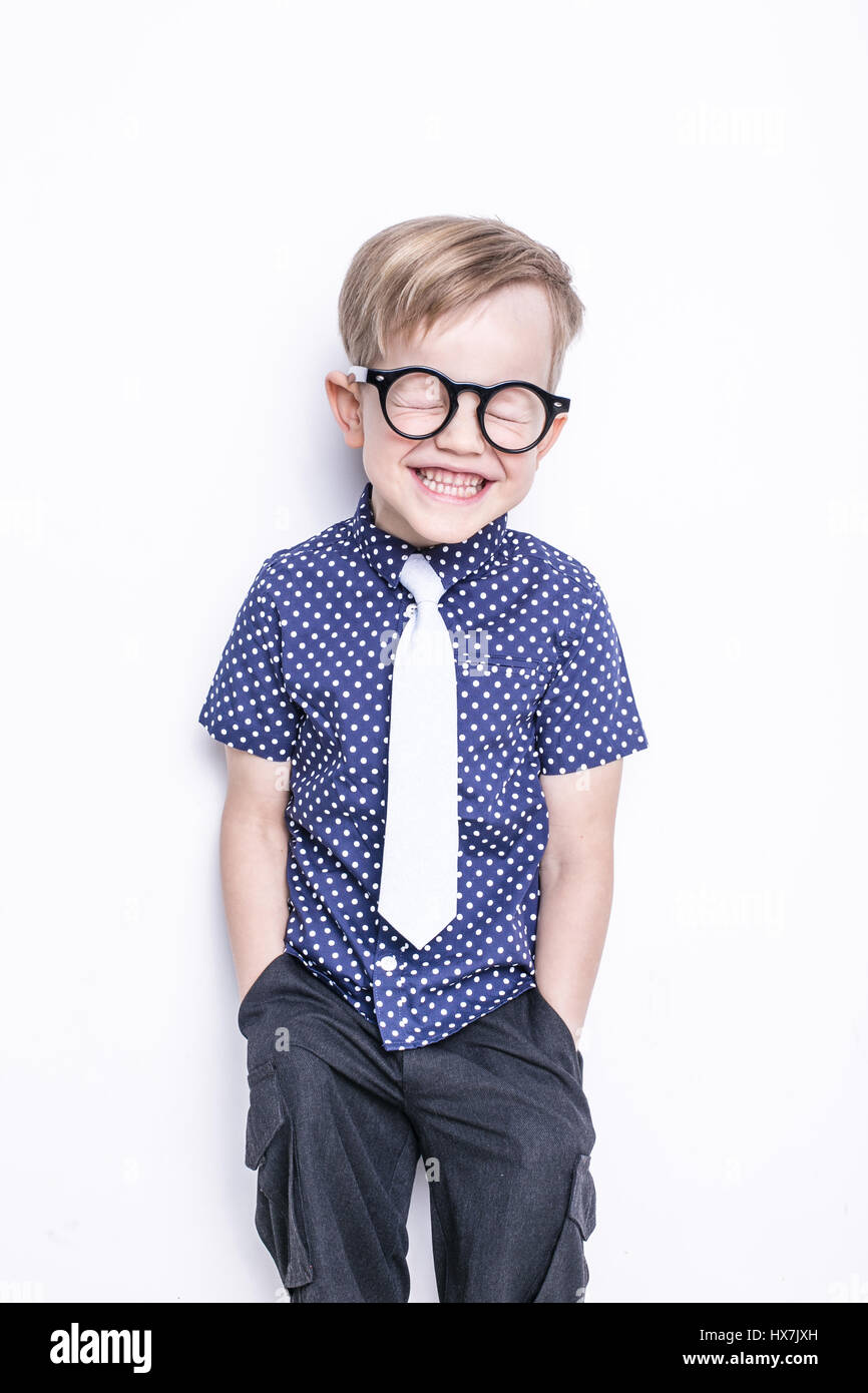 Portrait of a little boy in a funny glasses and tie. School. Preschool. Fashion. Studio portrait isolated over white background Stock Photo