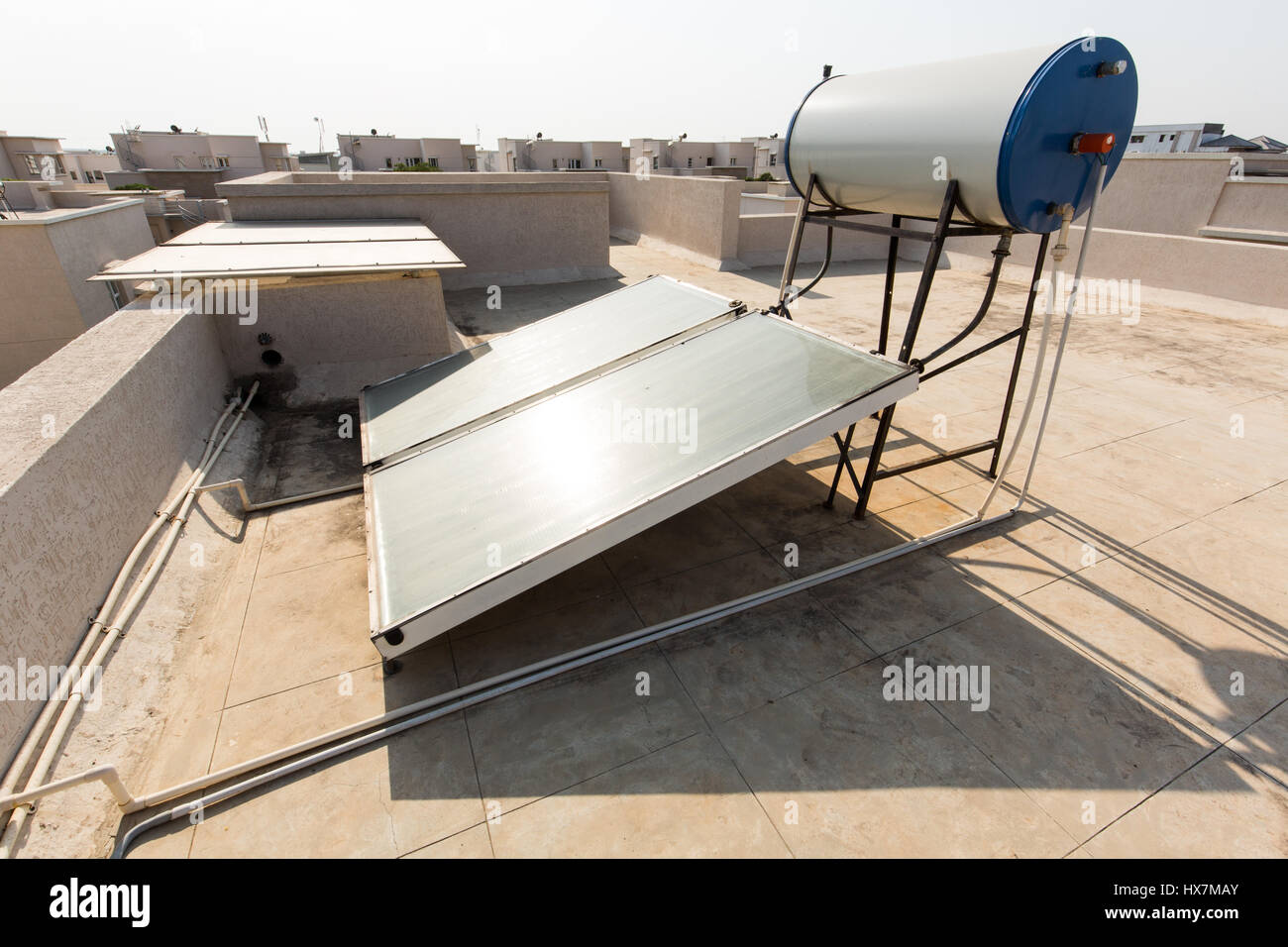 Solar water heater system on the roof of a house in Hyderabad,India Stock Photo