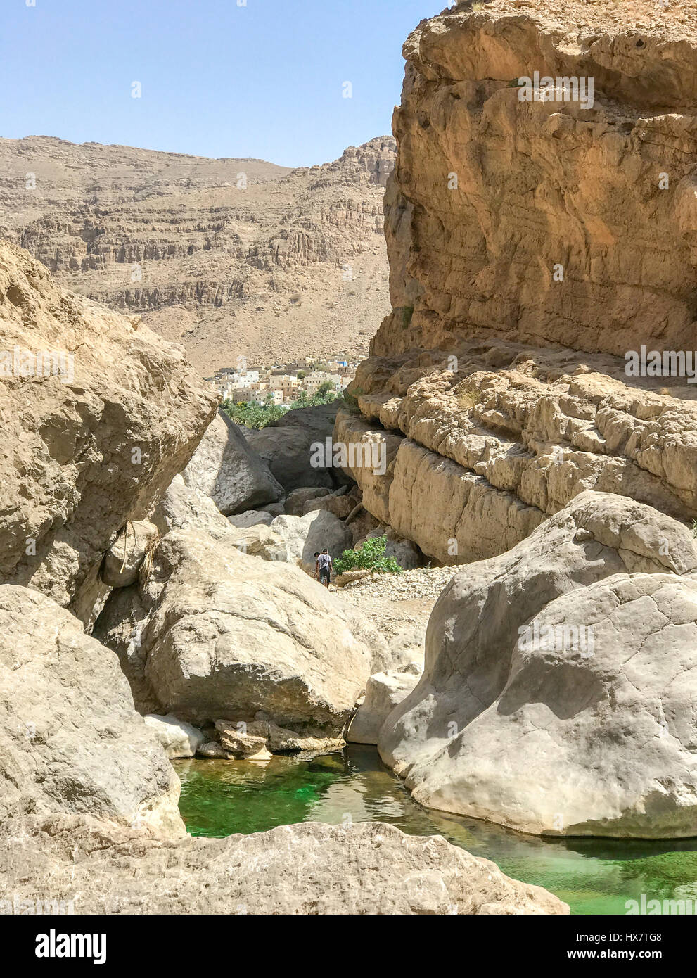 Path between rocks to reach Wadi Bani Khalid lakes, in Oman near Sur. Stock Photo