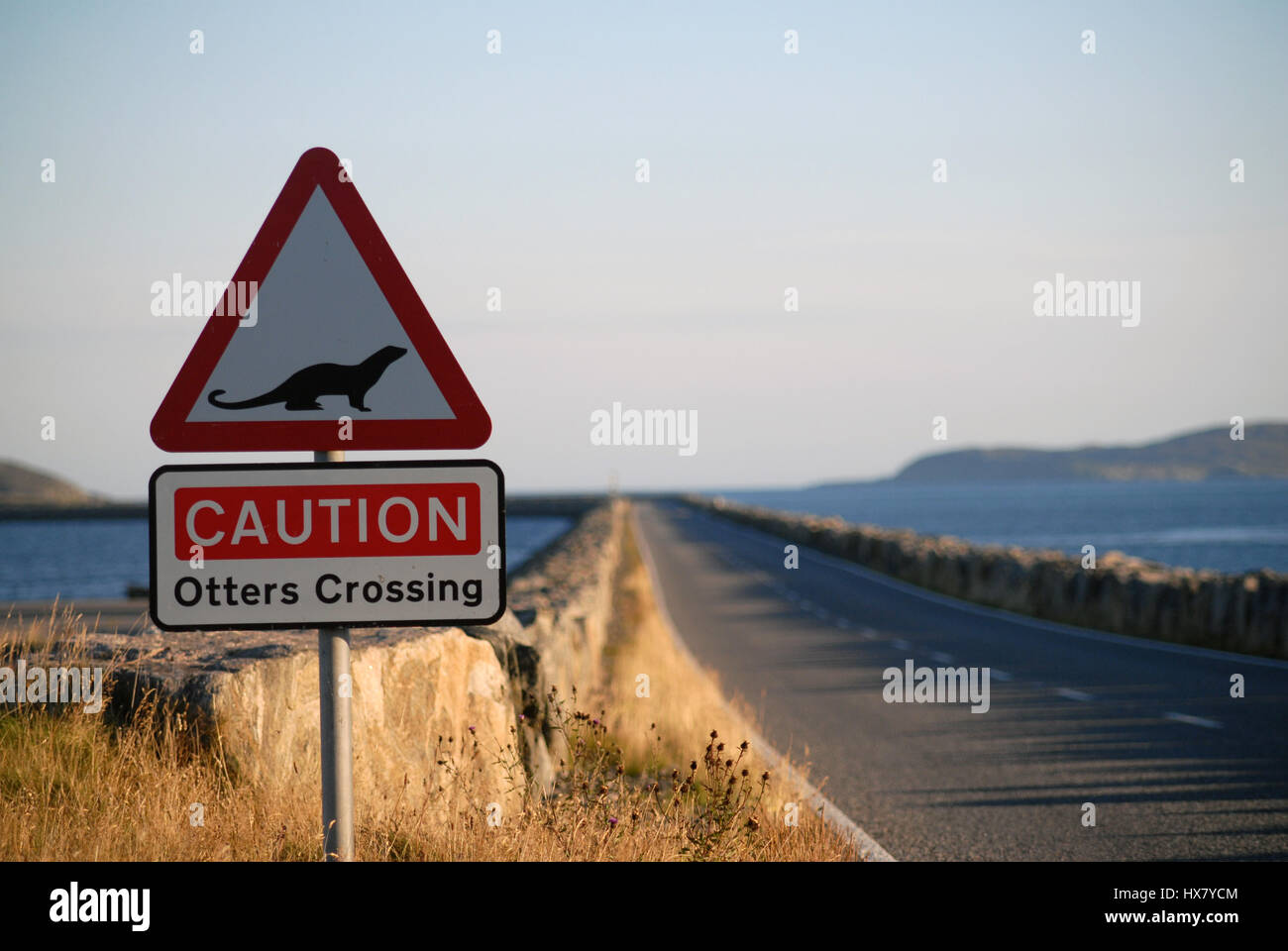 Otters Crossing Sign on a causeway, South Uist, Outer Hebrides, Scotland Stock Photo
