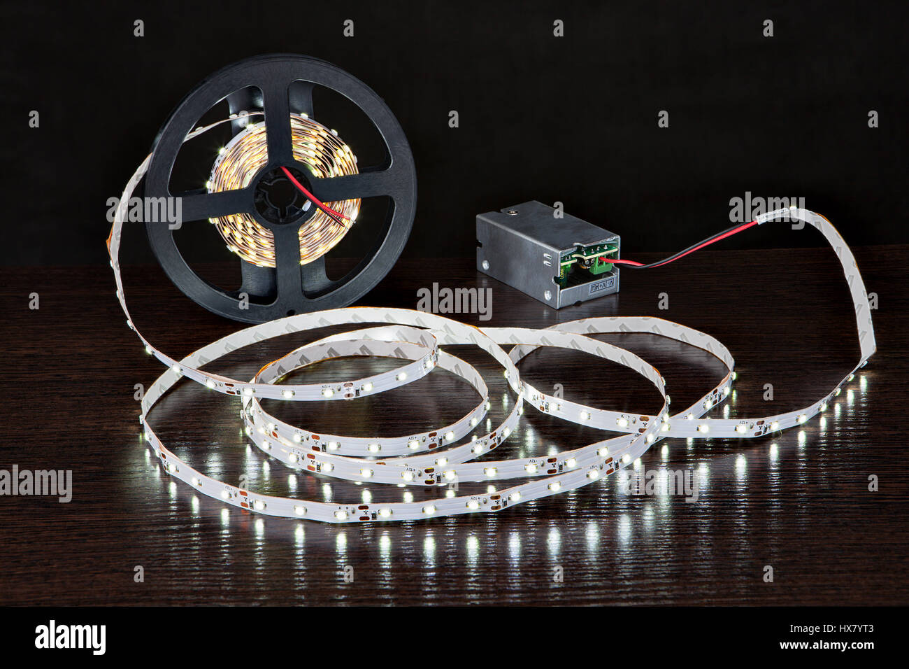 Spool of luminous LED strip light connected to Power Supply Adapter Driver  Stock Photo - Alamy