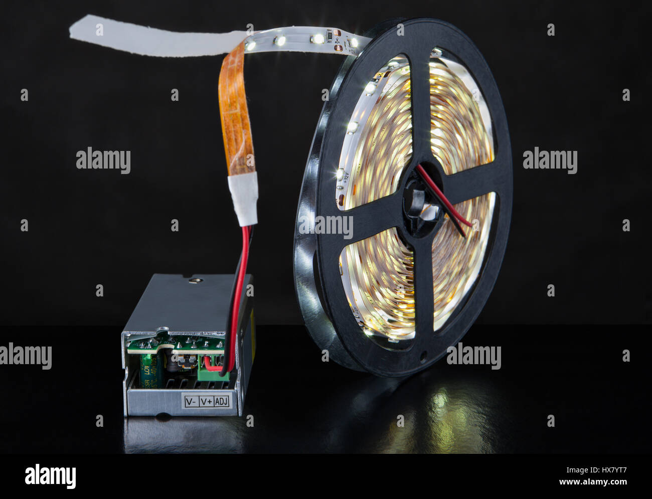 Spool of luminous LED strip light connected to Power Supply Adapter Driver  Stock Photo - Alamy