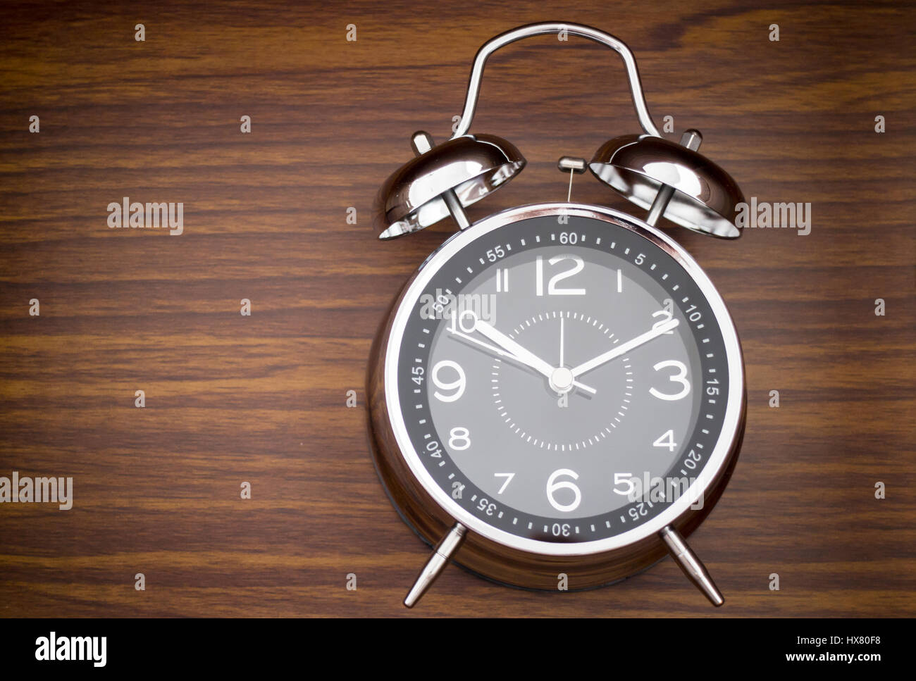 Alarm Clock On Wooden Background Stock Photo - Alamy