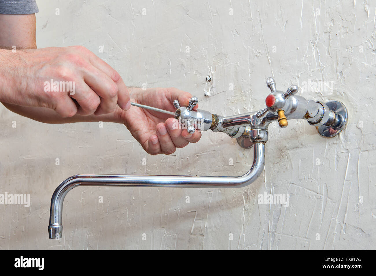 Plumbing Repair Plumber Unscrews Handle Kitchen Faucet Using Hand