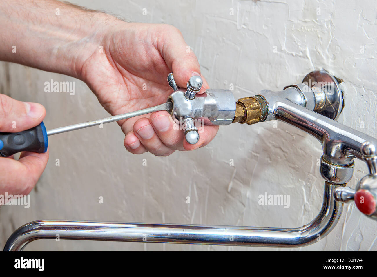 Kitchen Faucet Repair Plumber Hands Unscrew Retaining Screw Tap