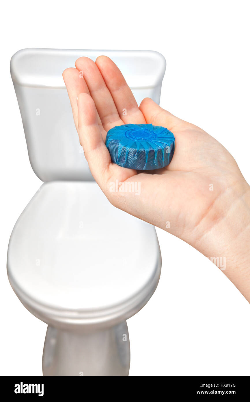 Closeup hands holding automatic bleach toilet bowl cleaner blue tabs