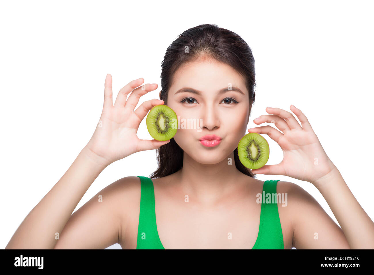 Tropical fruits. Healthy eating. Charming young asian woman holding
