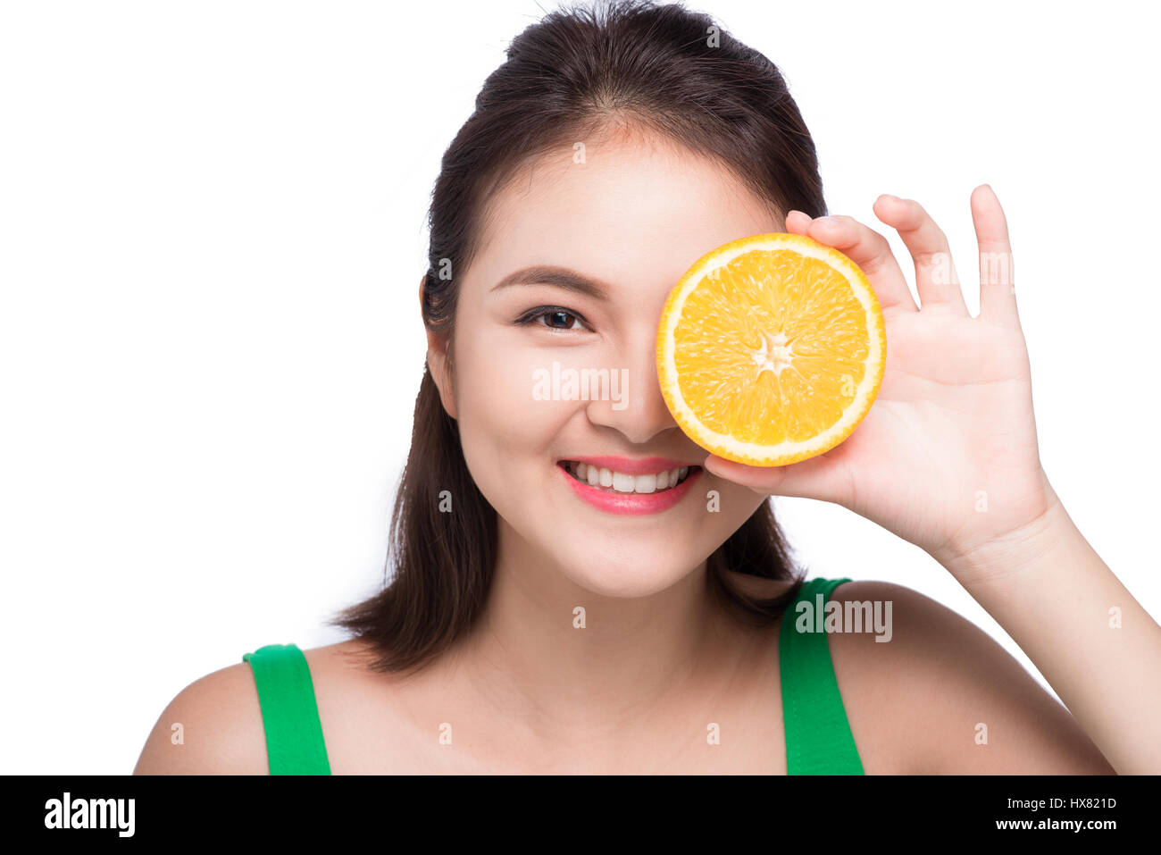Beauty Model Girl Holding Orange Slices and laughing, emotions on white. Stock Photo