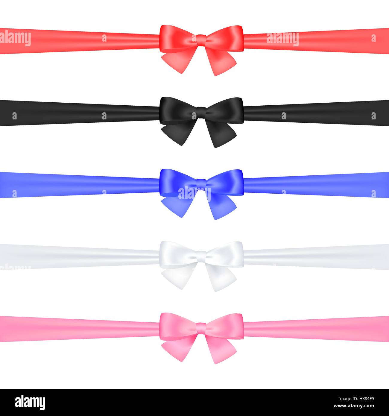A set of satin ribbons tied in bows of different colors on a white ...