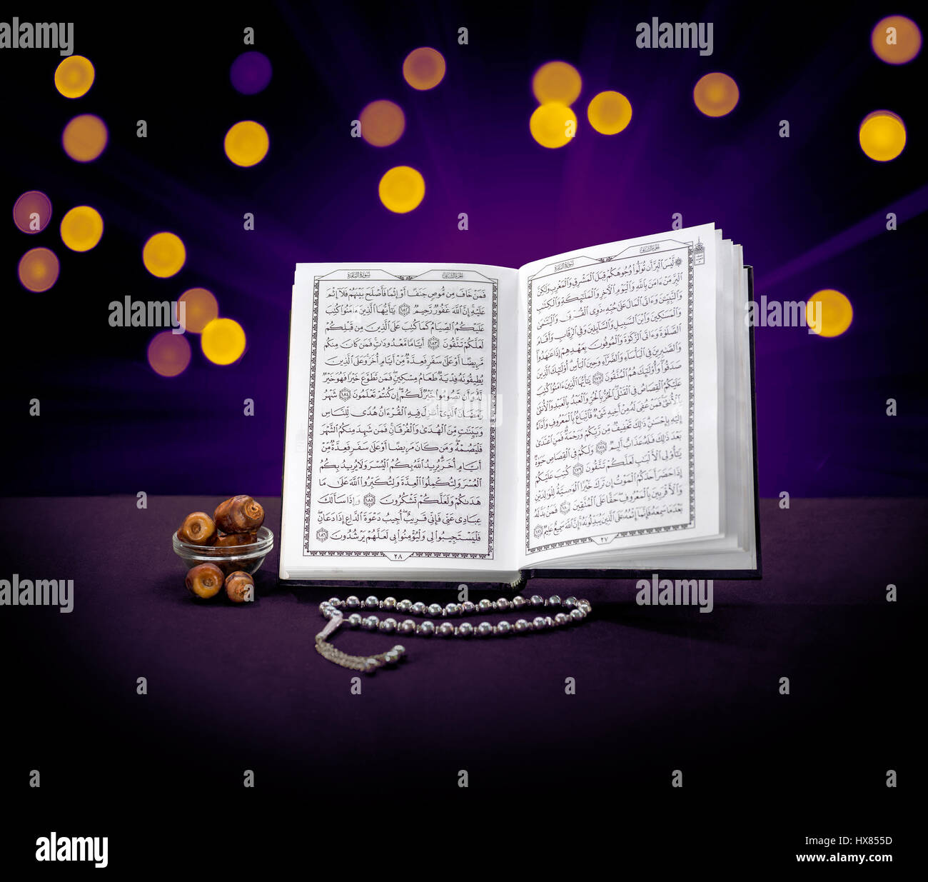 Open Holy Quran Book With Rosary and Dates, Ramadan Concept Stock Photo