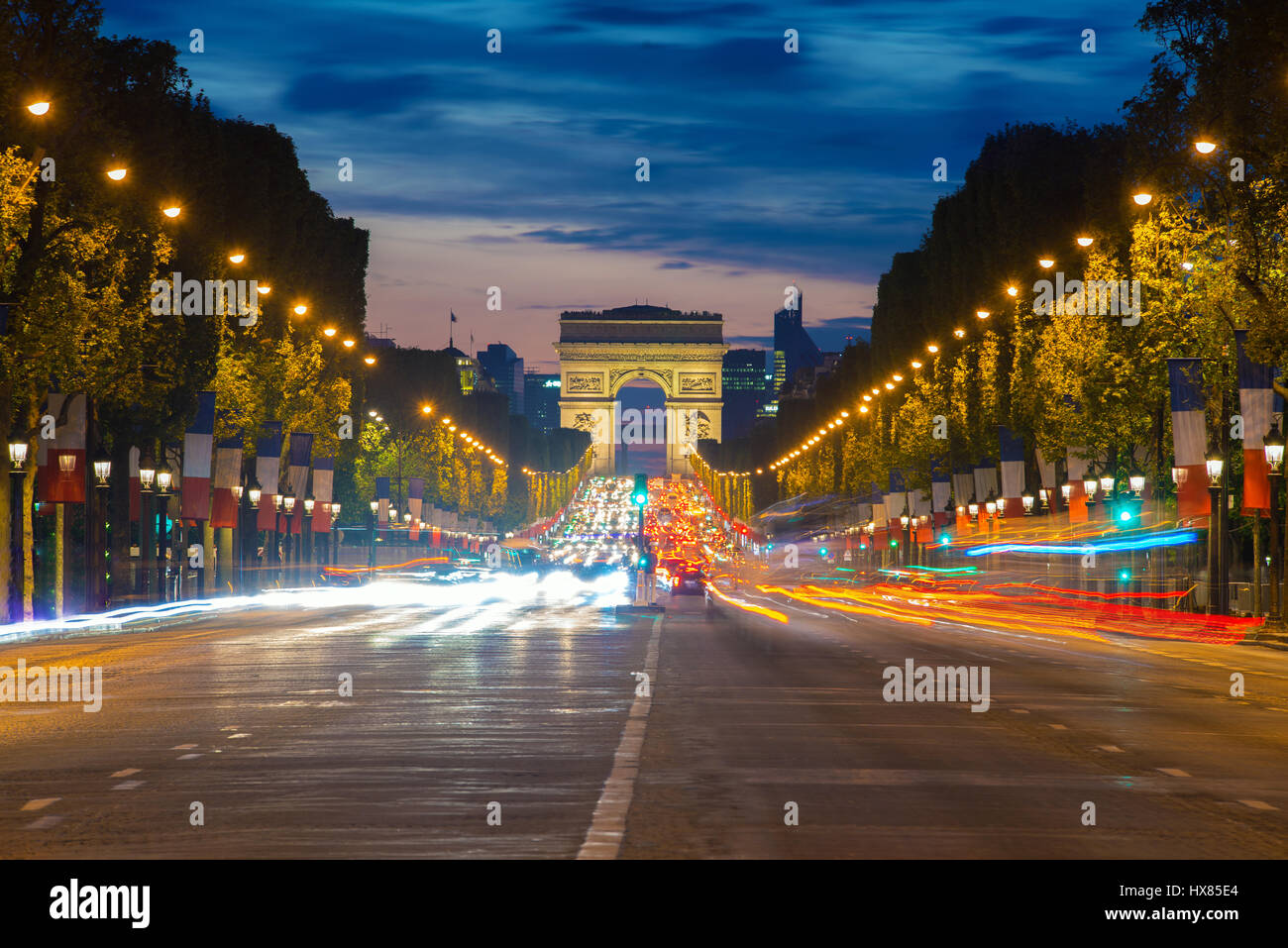 Night view of Paris traffic in Champs-Elysees street and the Arc de Triomphe in Paris, France. Stock Photo