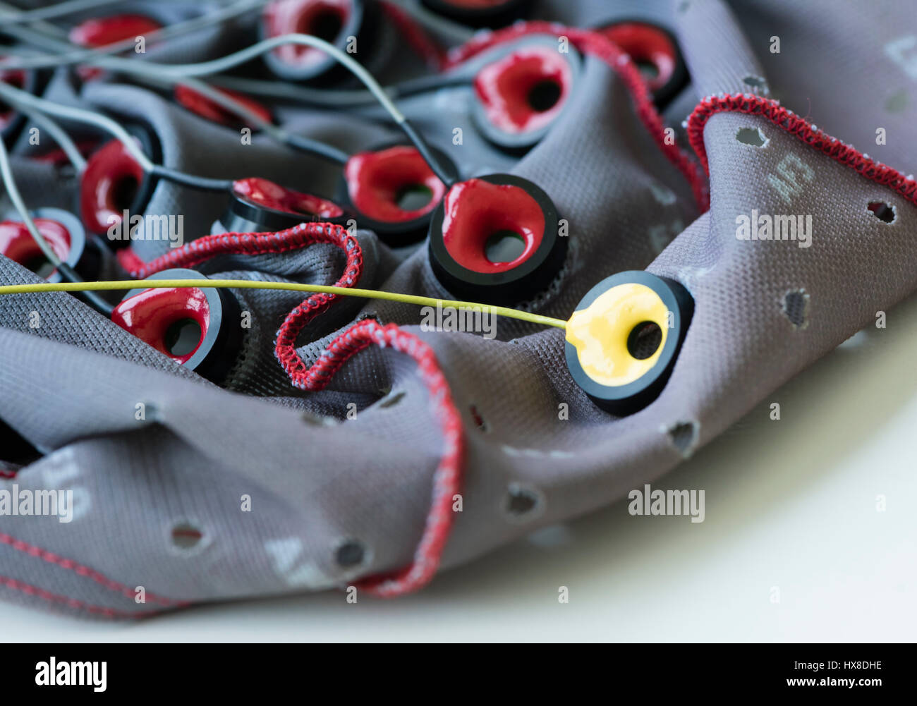 Wired electrodes on a Brain-Computer Interface (BCI) hood that is used to translate brain activity into signals that control a computer at a neuroscience lab Stock Photo