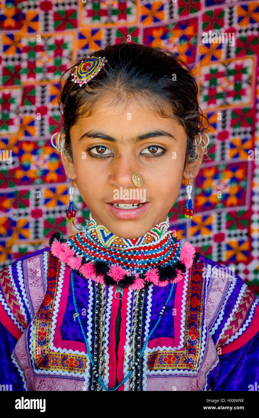 KUTCH, GUJARAT, INDIA - DECEMBER 27, 2016: Closeup of an unidentified beautiful young girl with traditional embroidered clothes near Dhordo village. Stock Photo