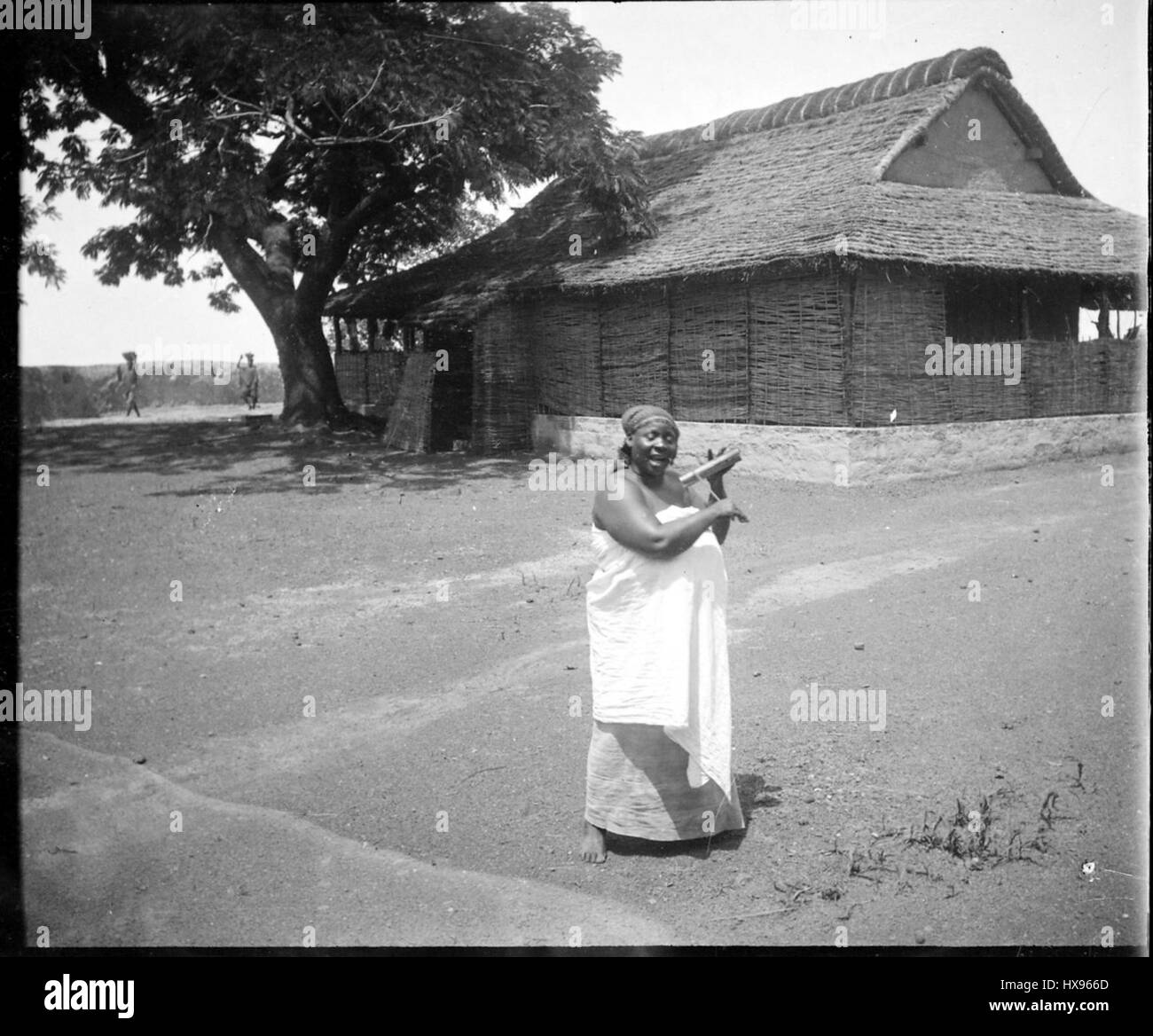Woman standing front house Black and White Stock Photos & Images - Alamy